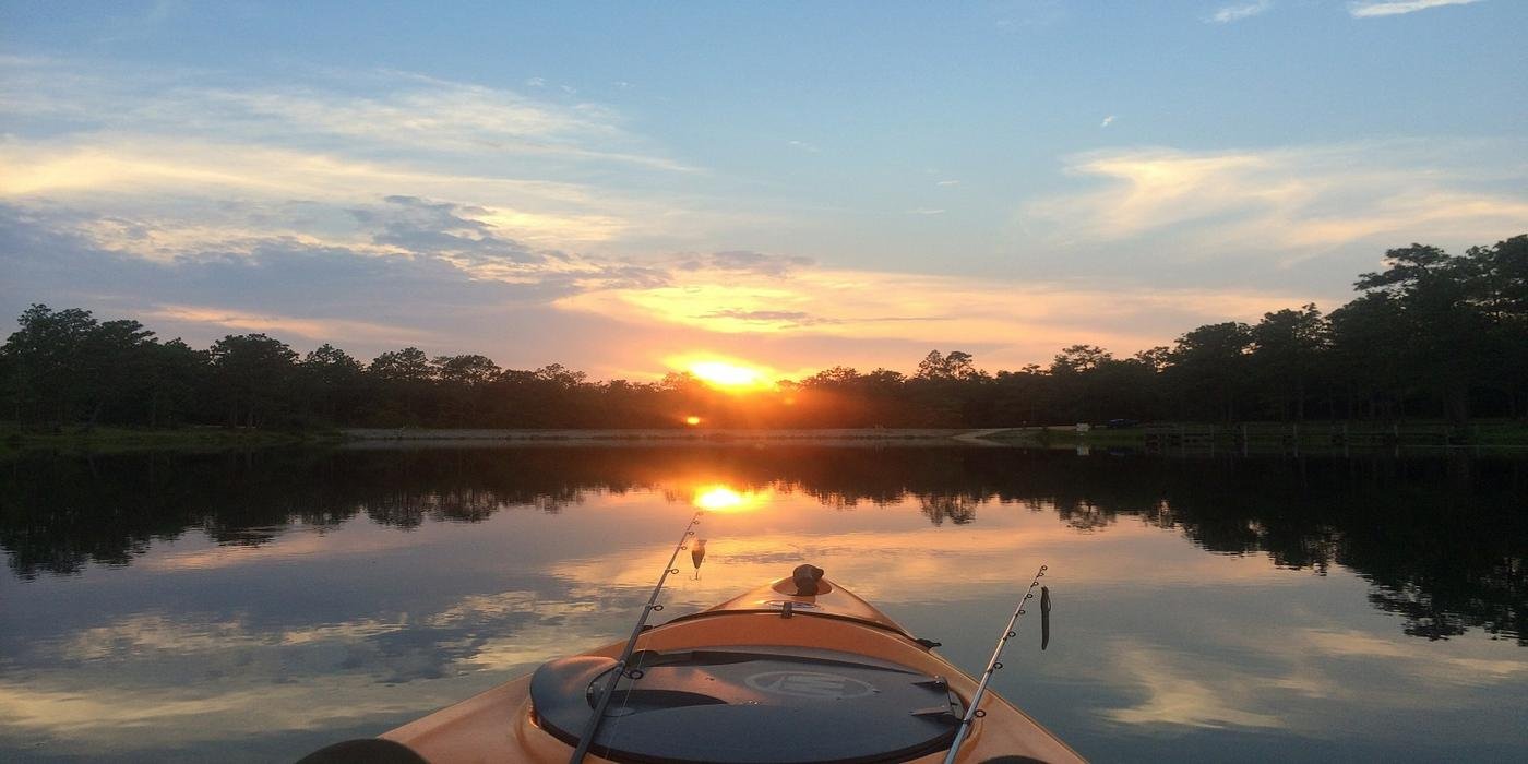 Sunset view from a kayak while fishing on Lake Athens